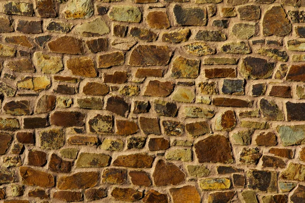 Old rustic looking stone wall good for texture or background