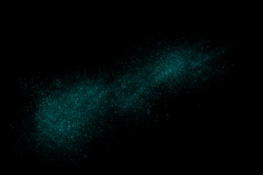 Turkuaz soyut toz patlama siyah bir zemin üzerine