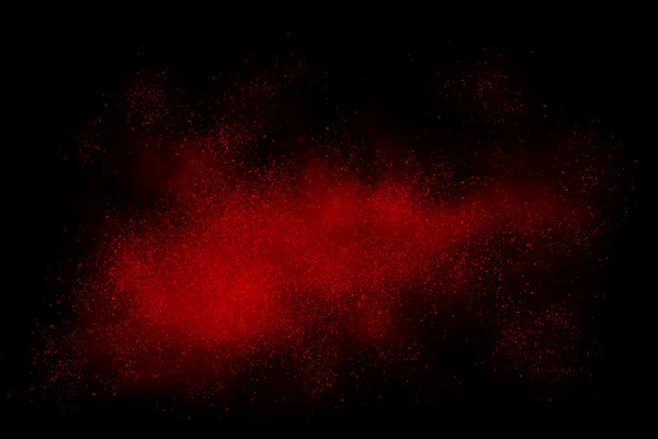 Rote abstrakte Pulverexplosion auf schwarzem Hintergrund — Stockfoto