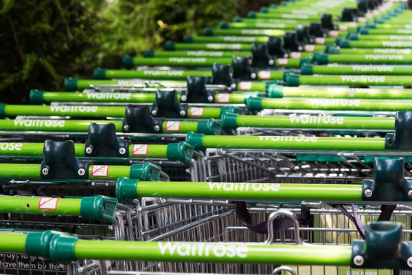 BEACONSFIELD, ENGLAND - JUNE 2016: Waitrose shopping trollies ou — Stock Photo, Image