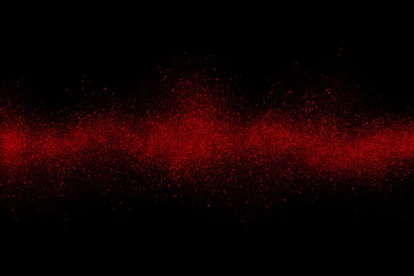 Czerwony Abstrakcja proszku wybuch na czarnym tle — Zdjęcie stockowe