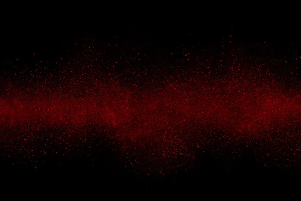 Czerwony Abstrakcja proszku wybuch na czarnym tle — Zdjęcie stockowe
