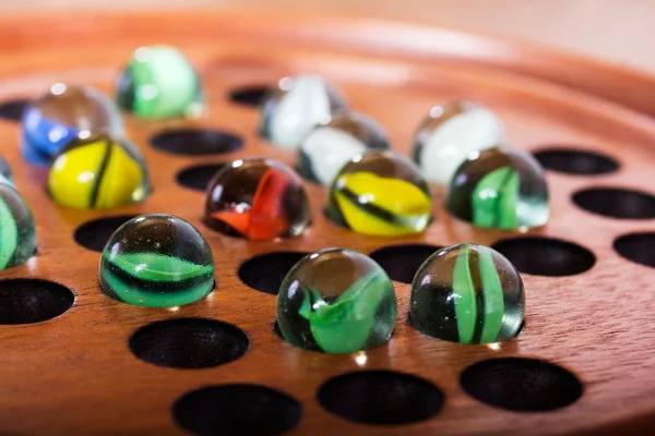 Close up of marbles in a solitare game — Stock Photo, Image