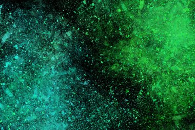 Siyah bir arka plan üzerinde renkli soyut toz patlama