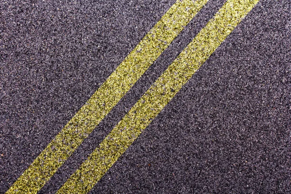 Tarmac design with diagonal double yellow lines — Stock Photo, Image