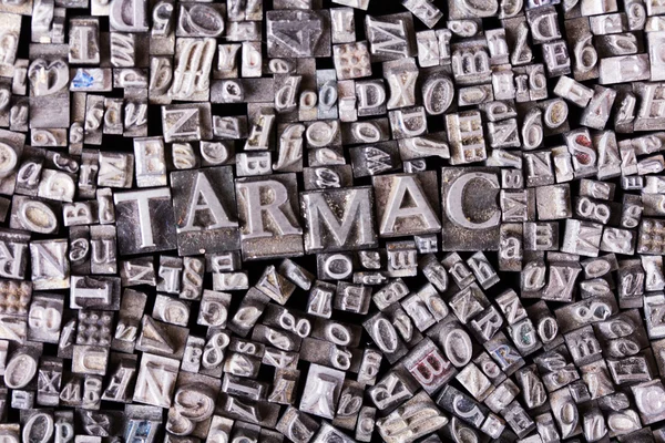 Close up of typeset letters with the word tarmac — Stock Photo, Image