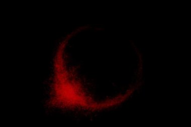 Siyah bir arka plan üzerinde renkli soyut toz patlama