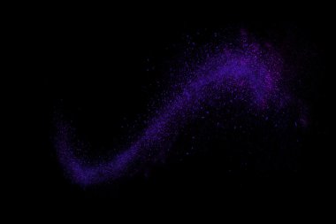 Siyah bir arka plan üzerinde renkli soyut toz patlama