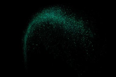 Siyah bir arka plan üzerinde renkli soyut toz patlama