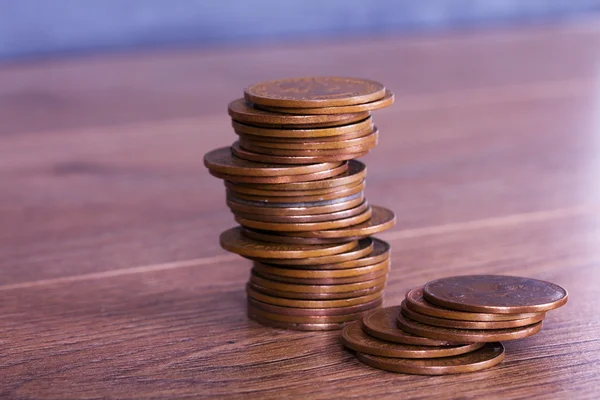 Stack of penny coins on a wooden surface