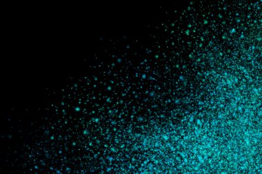 Siyah bir arka plan üzerinde renkli soyut toz patlama