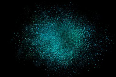 Siyah bir arka plan üzerinde renkli soyut toz patlama