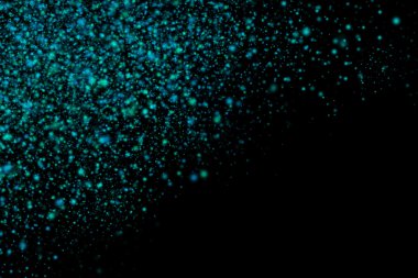 Siyah bir arka plan üzerinde renkli soyut toz patlama