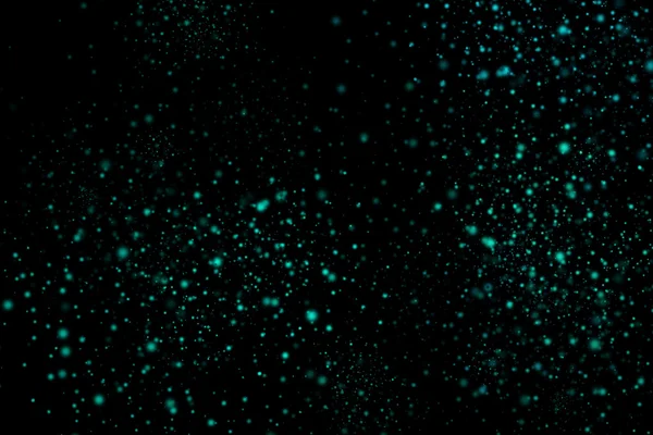 Siyah bir arka plan üzerinde renkli soyut toz patlama