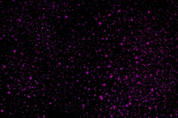 Siyah bir arka plan üzerinde renkli soyut toz patlama