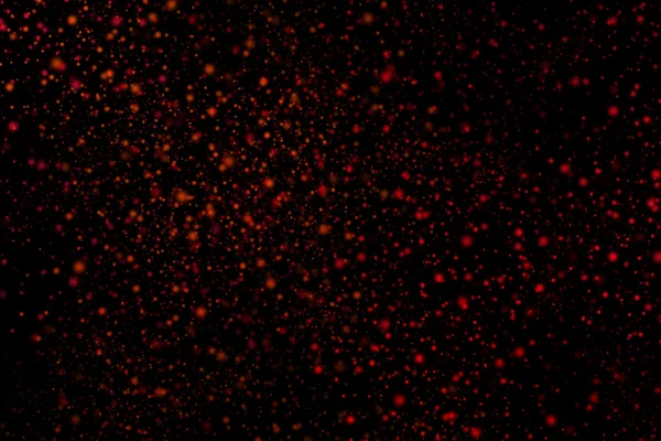 Siyah bir arka plan üzerinde renkli soyut toz patlama