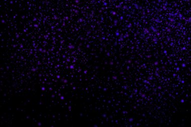 Siyah bir arka plan üzerinde renkli soyut toz patlama