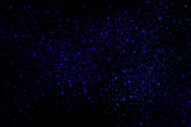 Siyah bir arka plan üzerinde renkli soyut toz patlama