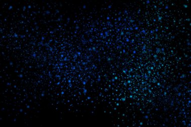 Siyah bir arka plan üzerinde renkli soyut toz patlama