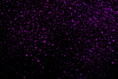 Siyah bir arka plan üzerinde renkli soyut toz patlama