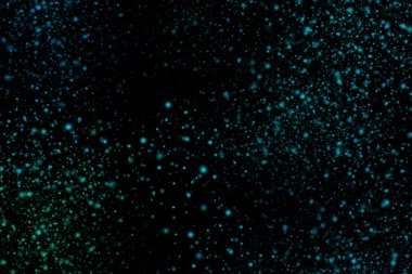 Siyah bir arka plan üzerinde renkli soyut toz patlama