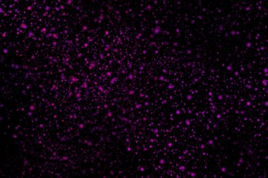 Siyah bir arka plan üzerinde renkli soyut toz patlama