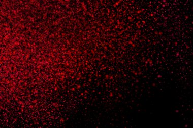 Siyah bir arka plan üzerinde renkli soyut toz patlama