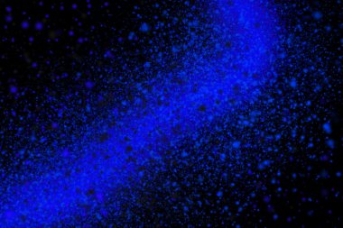 Siyah bir arka plan üzerinde renkli soyut toz patlama