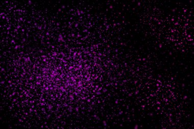 Siyah bir arka plan üzerinde renkli soyut toz patlama