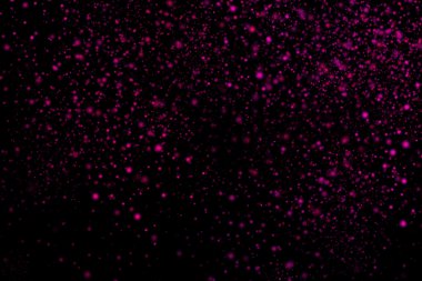 Siyah bir arka plan üzerinde renkli soyut toz patlama