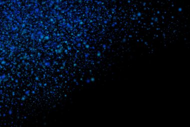 Siyah bir arka plan üzerinde renkli soyut toz patlama