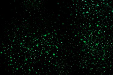 Siyah bir arka plan üzerinde renkli soyut toz patlama