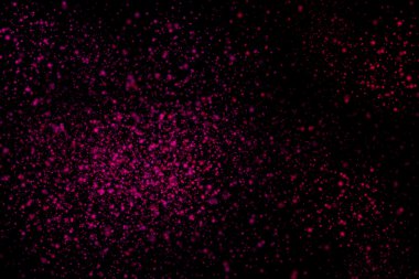 Siyah bir arka plan üzerinde renkli soyut toz patlama