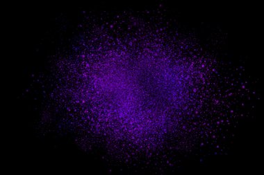 Siyah bir arka plan üzerinde renkli soyut toz patlama