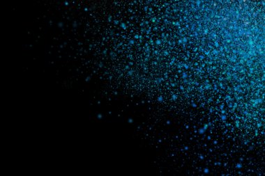 Siyah bir arka plan üzerinde renkli soyut toz patlama