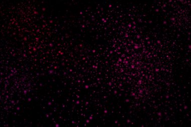 Siyah bir arka plan üzerinde renkli soyut toz patlama