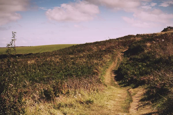 Uitzicht vanaf de ribben pad in de buurt van Polzeath. Vintage Retro Filter. — Stockfoto