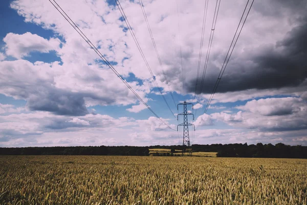 Electricity pylons going across the English countryside Vintage