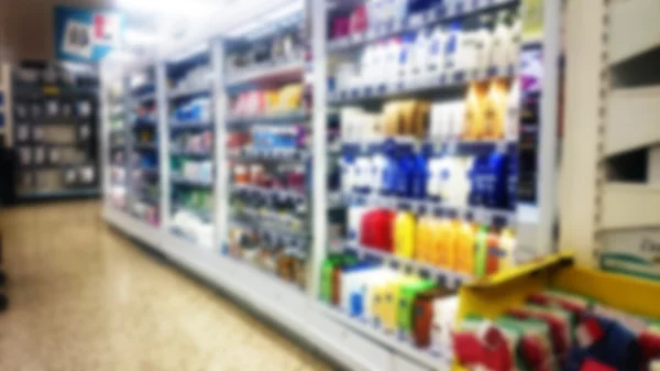 Shelves inside a supermarket. Out of focus. — Stock Photo, Image