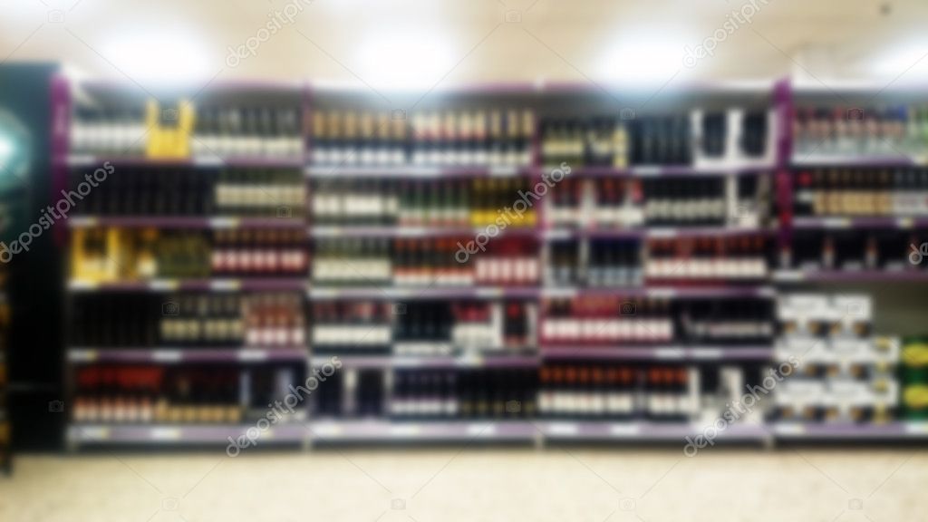 Shelves inside a supermarket. Out of focus.