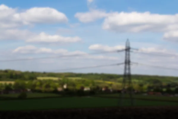 Piloni elettrici che attraversano la campagna inglese Fuori — Foto Stock