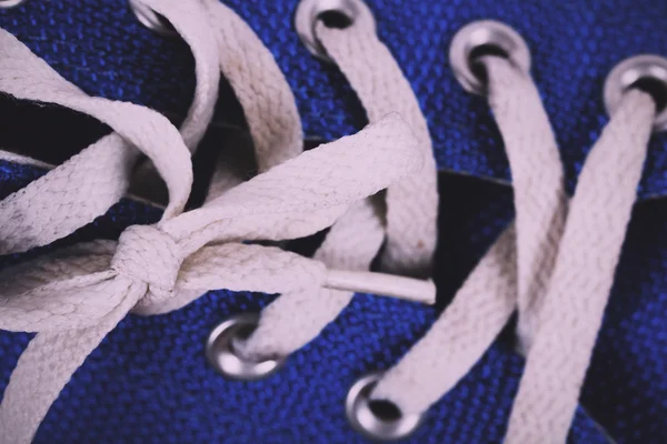 Old canvas shoes on a wooden floor Vintage Retro Filter. — Stock Photo, Image