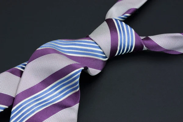 Man's tie on a black background — Stock Photo, Image