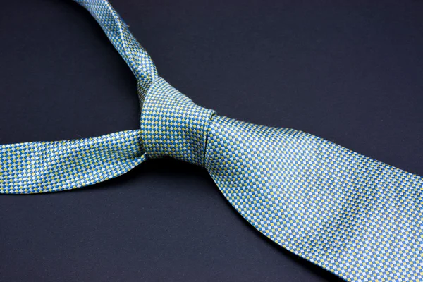 Man's tie on a black background — Stock Photo, Image