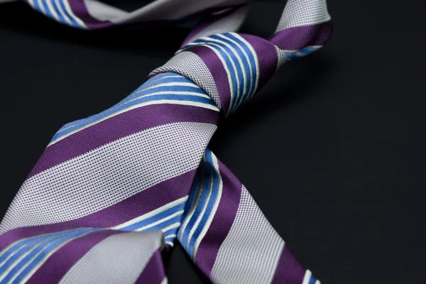 Man's tie on a black background — Stock Photo, Image