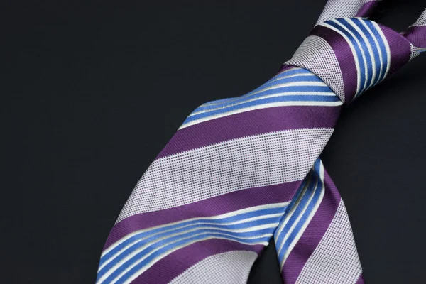 Man's tie on a black background — Stock Photo, Image