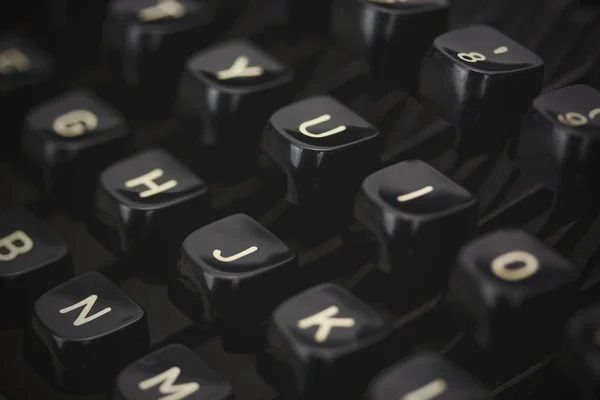 Close up of lettered keys on an old typewriter. Vintage filter a — Stock Photo, Image