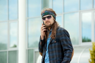 Young hipsters with the phone.