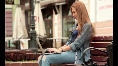 Young stylish woman with a laptop.