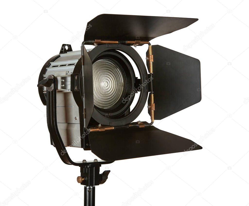 Constant light illuminator with curtains and fresnel lens on a stand for filming movies. The device is isolated on a white background.